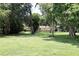 Traditional home with a spacious front yard and mature tree coverage at 860 Oak Shore Dr, St Cloud, FL 34771