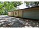 Side view of a home with a detached garage and paved driveway at 860 Oak Shore Dr, St Cloud, FL 34771