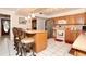 Well-lit kitchen with an island counter, modern appliances, and plentiful wooden cabinets at 860 Oak Shore Dr, St Cloud, FL 34771