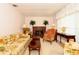 Comfortable living room with fireplace, floral patterned furniture, and traditional decor at 860 Oak Shore Dr, St Cloud, FL 34771