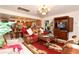 Inviting living room with a leather sofa, ornate details, and an open flow to the kitchen area at 860 Oak Shore Dr, St Cloud, FL 34771