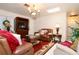 Cozy living room featuring leather furniture, area rug, and traditional decor with a skylight at 860 Oak Shore Dr, St Cloud, FL 34771