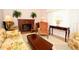 Inviting living room showcasing a fireplace, warm lighting, piano and classic furniture at 860 Oak Shore Dr, St Cloud, FL 34771