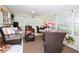 Sun room with wicker furniture, glass table and large windows offering natural light at 860 Oak Shore Dr, St Cloud, FL 34771