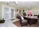 Sun room with wicker furniture, glass table and large windows offering natural light at 860 Oak Shore Dr, St Cloud, FL 34771