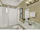 Clean bathroom featuring a tub, shower, vanity with neutral colors and decor at 8716 Rain Forest Pl # D, Kissimmee, FL 34747