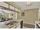 Spacious kitchen with breakfast bar, seamlessly connecting to the living and dining areas at 8716 Rain Forest Pl # D, Kissimmee, FL 34747