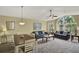 Open-concept living and dining area with comfortable seating, ample natural light, and stylish decor at 8716 Rain Forest Pl # D, Kissimmee, FL 34747