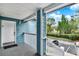 Condo front porch with painted railings and a welcoming view of the parking area at 8716 Rain Forest Pl # D, Kissimmee, FL 34747