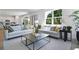 Bright living room showcases contemporary sofas, stylish decor, and an open-concept layout at 1022 Wisteria Way, Dundee, FL 33838