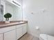 Bright bathroom with large mirror, vanity, and ample counter space at 109 Pompano Beach Dr, Kissimmee, FL 34746