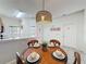 Inviting dining area with a round table, perfect for intimate gatherings and daily meals at 109 Pompano Beach Dr, Kissimmee, FL 34746