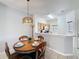 Cozy dining area featuring a charming round table and stylish lighting fixture at 109 Pompano Beach Dr, Kissimmee, FL 34746