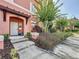 Close view of #109 Front entrance featuring a covered pergola, plants, a sidewalk, and easy accessibility at 109 Pompano Beach Dr, Kissimmee, FL 34746