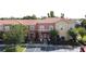 Charming townhomes showcasing a colorful facade, well-manicured landscaping, and ample parking at 109 Pompano Beach Dr, Kissimmee, FL 34746