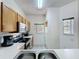 View of the kitchen with ample counter space, stainless appliances, and bright natural light at 109 Pompano Beach Dr, Kissimmee, FL 34746