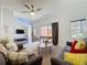 Comfortable living room with two sofas, a ceiling fan, and access to a patio at 109 Pompano Beach Dr, Kissimmee, FL 34746