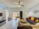 Bright living room with a foosball table and sliding doors leading to outdoor space at 109 Pompano Beach Dr, Kissimmee, FL 34746