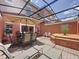 Screened patio featuring outdoor furniture, a built-in spa, and a dining area, all surrounded by a serene outdoor setting at 109 Pompano Beach Dr, Kissimmee, FL 34746