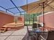 Screened patio with brick pavers, outdoor seating, and a built-in spa with plenty of room for entertaining guests at 109 Pompano Beach Dr, Kissimmee, FL 34746