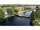 Picturesque pond and walking path offering serene views, and beautiful landscaping at 109 Pompano Beach Dr, Kissimmee, FL 34746