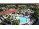 Beautiful aerial view of community pool and clubhouse with surrounding lush landscaping at 109 Pompano Beach Dr, Kissimmee, FL 34746