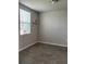 Bedroom featuring modern tile flooring and a bright window at 1210 Zambrana Ct, Winter Haven, FL 33884