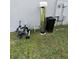 Side view of the house, showing the water filtration system at 1210 Zambrana Ct, Winter Haven, FL 33884