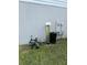 Side view of the house, showing the water filtration system at 1210 Zambrana Ct, Winter Haven, FL 33884
