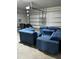 Garage features a seating area with a sectional and individual seats at 1210 Zambrana Ct, Winter Haven, FL 33884