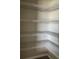 Spacious pantry featuring multiple rows of white wire shelving at 1210 Zambrana Ct, Winter Haven, FL 33884