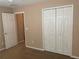 Bedroom featuring closet and carpet flooring at 13620 Cepheus Dr, Orlando, FL 32828