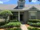 Inviting home exterior with lush landscaping and charming architectural details on a sunny day at 13620 Cepheus Dr, Orlando, FL 32828