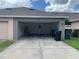 View of the garage showing ample space for parking and storage at 13620 Cepheus Dr, Orlando, FL 32828