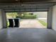 Garage features concrete floors and outdoor view at 13620 Cepheus Dr, Orlando, FL 32828