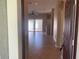 Spacious living room with tile floors, ceiling fan and sliding door access to the backyard at 13620 Cepheus Dr, Orlando, FL 32828
