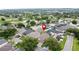A neighborhood featuring well-maintained houses with screened-in pools, mature trees, and a location marker at 1364 Rebecca Dr, Haines City, FL 33844