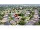 The aerial view shows a residential neighborhood with neat lawns and a red location marker centered on a house at 1364 Rebecca Dr, Haines City, FL 33844