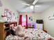 Comfortable bedroom featuring a ceiling fan and themed decor at 1364 Rebecca Dr, Haines City, FL 33844