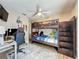 Bright bedroom with a wood bunk bed, stylish rug, and ceiling fan at 1364 Rebecca Dr, Haines City, FL 33844