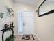 Bright foyer featuring tile flooring, decorative accents, and a welcoming atmosphere at 1364 Rebecca Dr, Haines City, FL 33844