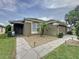 Charming single-story home with a well-manicured lawn and inviting entrance at 1364 Rebecca Dr, Haines City, FL 33844