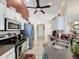 Spacious kitchen with stainless steel appliances, ample counter space, and view of the dining area at 1364 Rebecca Dr, Haines City, FL 33844