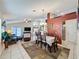 Open-concept living area with comfortable seating, modern entertainment center, and sliding glass doors to the backyard at 1364 Rebecca Dr, Haines City, FL 33844