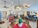 Open floor plan featuring kitchen, dining, and living areas with tile flooring and lots of natural light at 1364 Rebecca Dr, Haines City, FL 33844