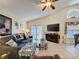 Comfortable living room with vaulted ceilings, sliding glass doors, and stylish decor at 1364 Rebecca Dr, Haines City, FL 33844