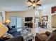 Spacious living room featuring high ceilings, comfortable seating, and natural light at 1364 Rebecca Dr, Haines City, FL 33844
