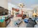 Open floor plan featuring kitchen, living, and dining areas with tile flooring and ample natural light at 1364 Rebecca Dr, Haines City, FL 33844