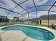 Relax in this kidney shaped pool inside a screened enclosure that is perfect for swimming or just lounging around at 1364 Rebecca Dr, Haines City, FL 33844