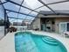 A stunning outdoor oasis with a kidney shaped pool and screened enclosure to enjoy the Florida sunshine year-round at 1364 Rebecca Dr, Haines City, FL 33844
